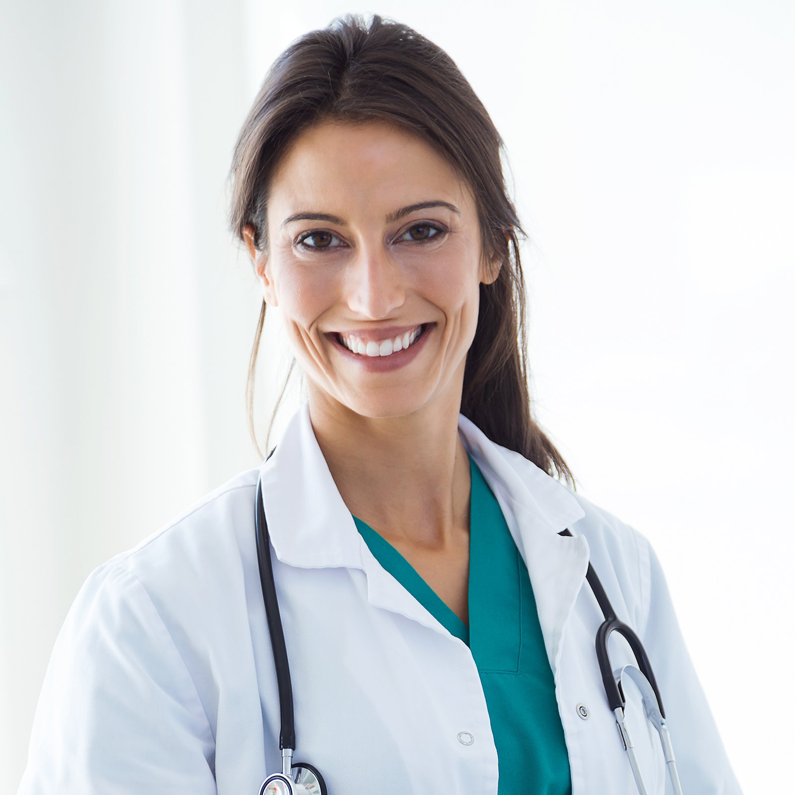 Beautiful young female doctor looking at camera in the office.